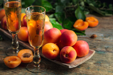 Fresh apricots and glasses apricot liquor.