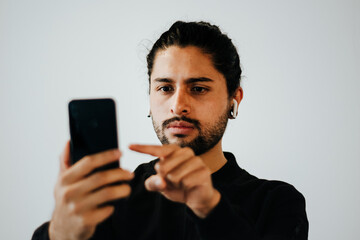 latin man with mobile phone