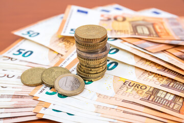 Fifty euro banknotes and coins.