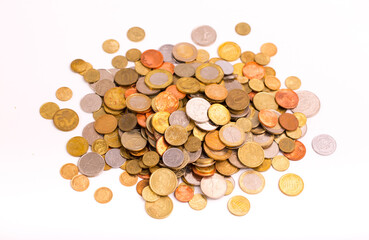 Different money coins. Money US dollars and euros on a white background. Savings and savings. Coins of different nominal from different countries.