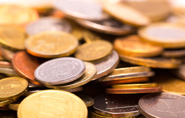 Different money coins. Money US dollars and euros on a white background. Savings and savings. Coins of different nominal from different countries.