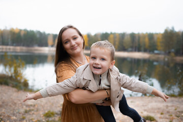 Beautiful mother holds a son in her arms