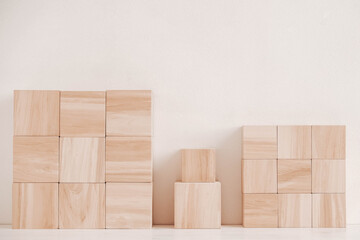 Wooden cubes from natural wood on a white background. Copy, empty space for text