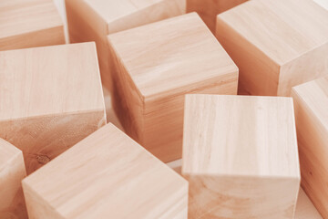 Wooden cubes from natural wood on a white background. Copy, empty space for text