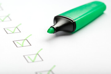 Green marker with markers on the checklist sheet.