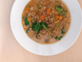 Homemade Sausage Soup with White Beans, Carrot, Spinach, Onion, and Garlic