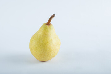 Yellow, juicy, ripe pear on a white background.