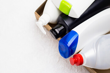 Plastic trash. White and black plastic packaging. Detergent.