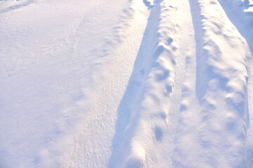 Fototapeta na wymiar Snowy road after snowfall in winter season. Snow background