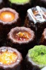 Caneles de bordeaux is a small pastry with rum and vanilla, traditional French sweet dessert.