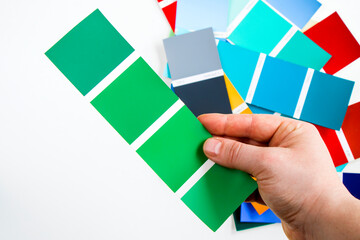 High angle view of color cards on the white background, variation and gradient of colors.