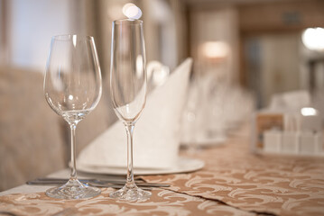 Champagne glass and wine glass on the table.