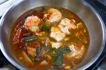 Korean spicy soft tofu stew pan isolated.