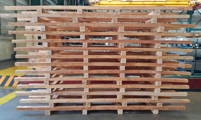 Wooden pallets, skid for cutting steel sheet in factory warehouse, metal industry, steel coil service center