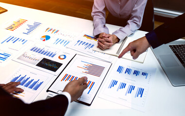 Team of business people working together in the meeting room office,
teamwork background charts and graphs banner, double exposure successful teamwork,business planning concept.
