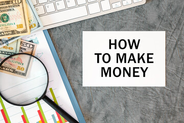Fototapeta premium How to make money is written in a document on the office desk, money, diagram and keyboard