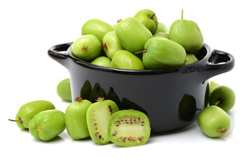 mini kiwi baby fruit (actinidia arguta) on white background 