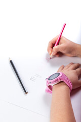 Little girl hand with smart watch. Child painting with GPS watch on hand.