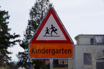 Traffic sign warning of crossing school and kindergarten children.