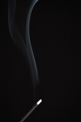 Incense burning giving of different patterns of smoke