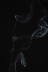 Incense burning giving of different patterns of smoke