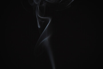 Incense burning giving of different patterns of smoke