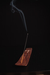 Incense burning giving of different patterns of smoke