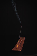Incense burning giving of different patterns of smoke