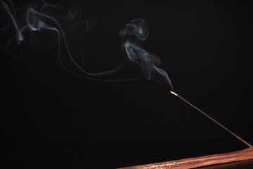 Incense burning giving of different patterns of smoke
