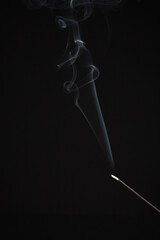 Incense burning giving of different patterns of smoke