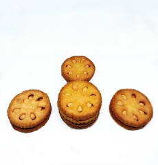 Medium orange round coconut biscuits are being served on the table, these biscuits are perfect for snacking with tea with the family