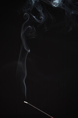 Incense burning giving of different patterns of smoke