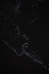 Incense burning giving of different patterns of smoke