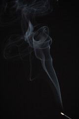 Incense burning giving of different patterns of smoke