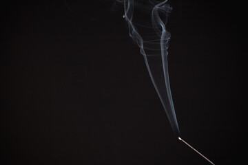 Incense burning giving of different patterns of smoke