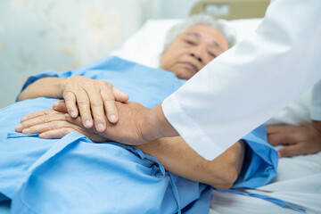 Doctor holding touching hands Asian senior or elderly old lady woman patient with love, care,...