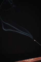 Incense burning giving of different patterns of smoke