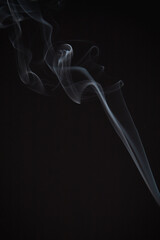 Incense burning giving of different patterns of smoke