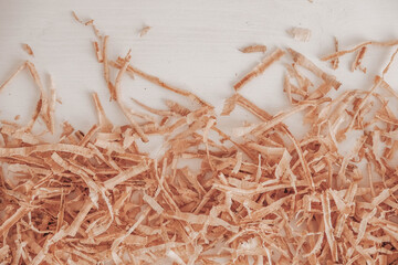 Wood shavings on white background. Top view. Copy, empty space for text
