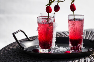 coctail with cranberries on a tray