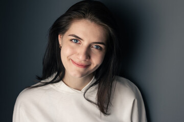 Young woman smiling. Happy brunette student.