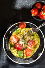 Fototapeta na wymiar fusilli pasta with tomatoes and basil