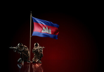 Concept of military conflict. Waving national flag of Cambodia. Illustration of coup idea. Two soldier statue guards defending the symbol of country against red wall