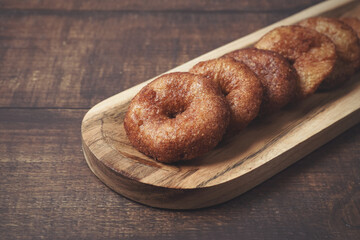 Indian homemade sweet snacks food Adhirasam on Wooden Tray	
