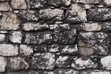 Gray stone wall close up.