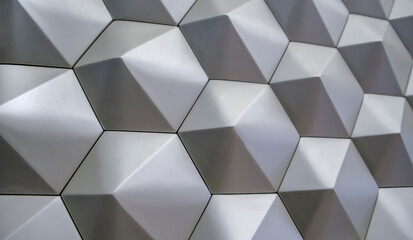 Fototapeta na wymiar Gray wall with abstract geometric pattern. Background image.