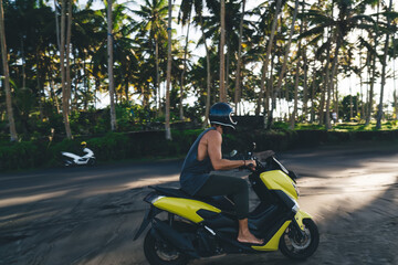 Man riding scooter on beach