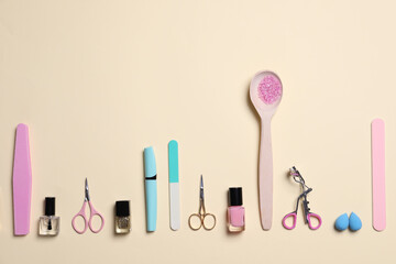 Flat lay composition with nail care products on beige background. Space for text