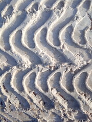 Obraz premium tire track in snow, tread in dirty snow