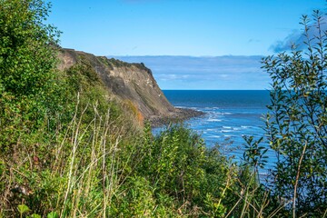 A view of the cliffs and sea at Robin Hood's Bay, Yorkshire